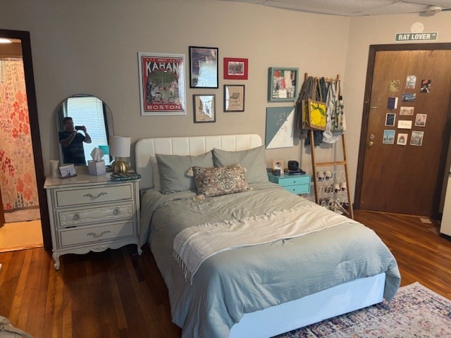 20 Benedict Street, Unit 1F Somerville, MA 02145 - Photo 7 of 12 a bedroom with a bed and wooden floor