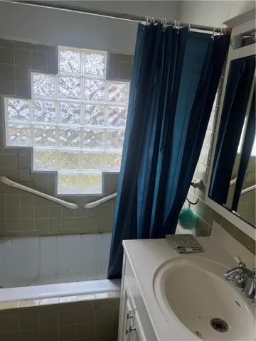 a bathroom with a sink and a tub