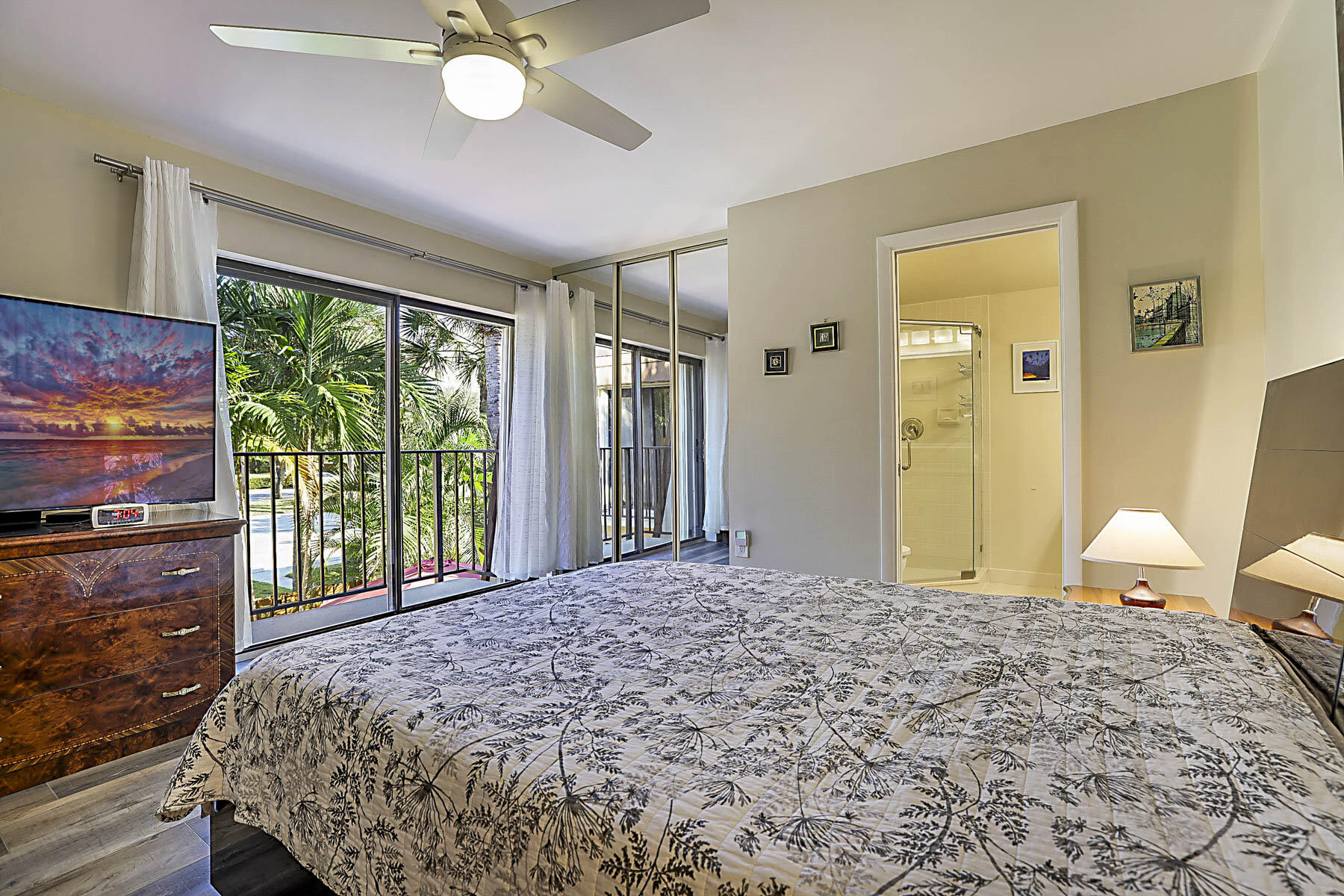 3071 30th Court Jupiter, FL 33477 - Photo 25 of 51 a bedroom with a bed and large window