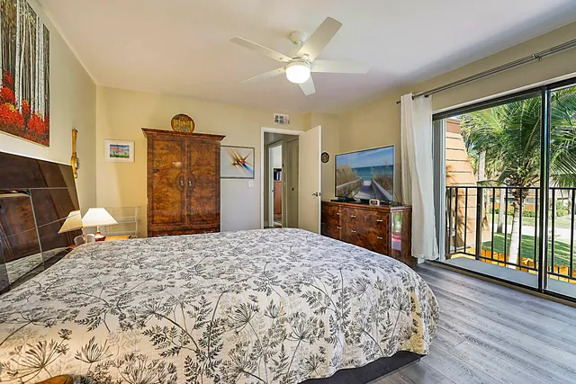 a bed room with a bed and a television