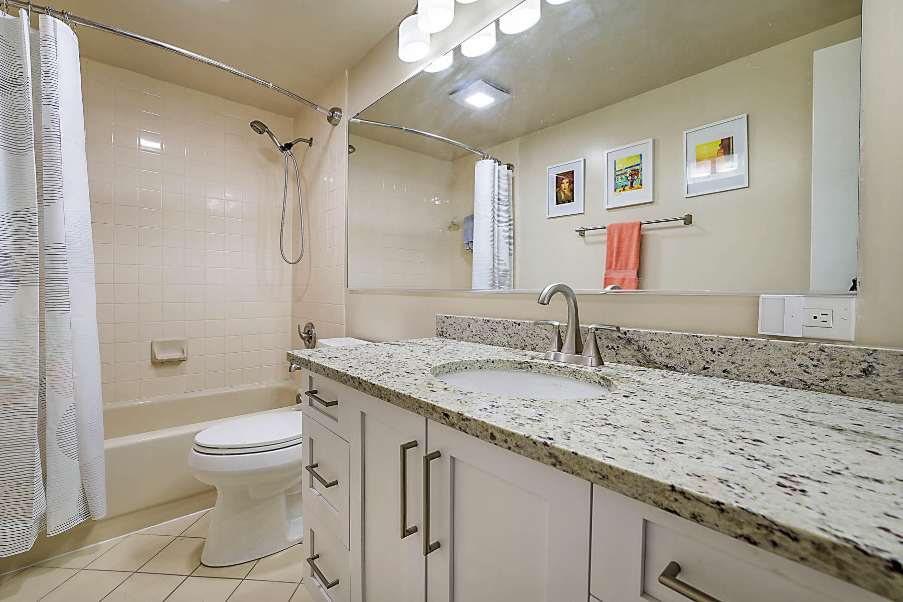 3071 30th Court Jupiter, FL 33477 - Photo 31 of 51 a bathroom with a granite countertop sink a toilet and a shower