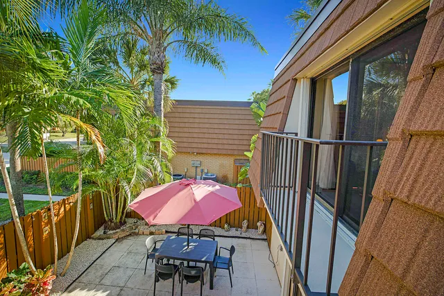 a view of a balcony with furniture