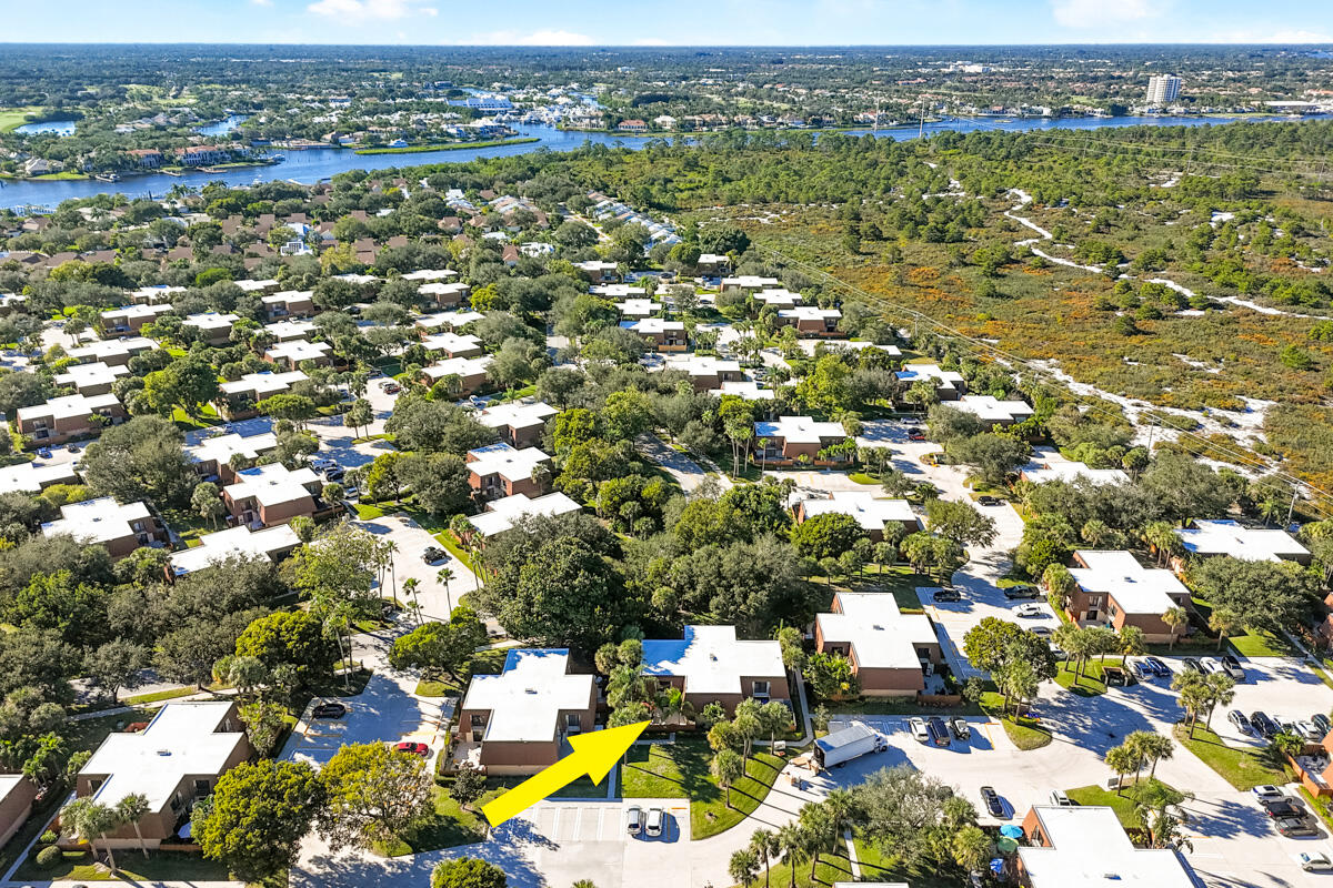 3071 30th Court Jupiter, FL 33477 - Photo 40 of 51 an aerial view of residential houses with outdoor space