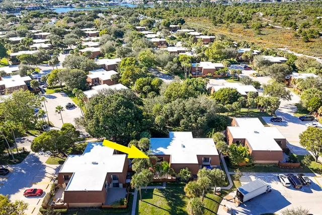 an aerial view of residential houses and swimming pool
