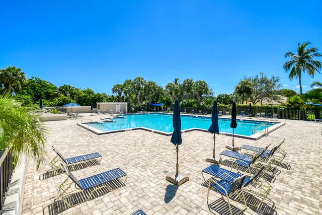 a view of a swimming pool with a patio