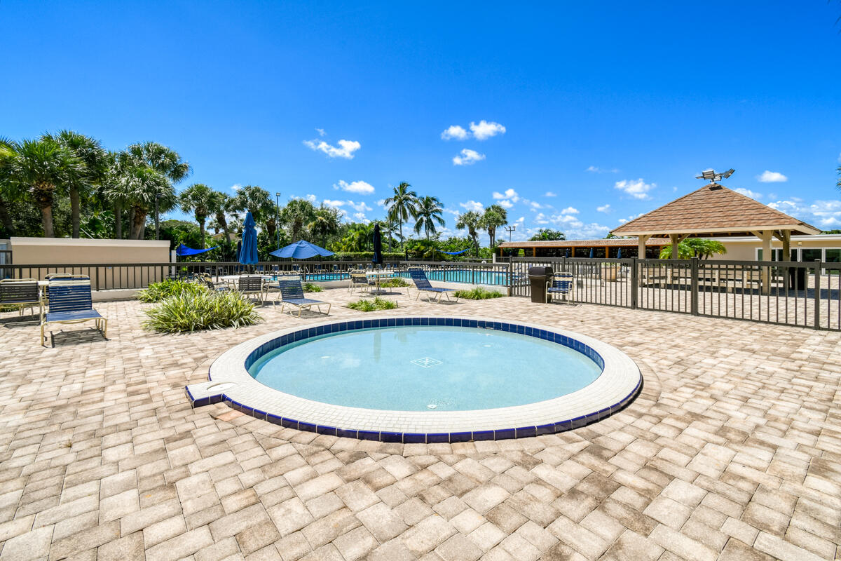 3071 30th Court Jupiter, FL 33477 - Photo 47 of 51 a view of a swimming pool with a patio