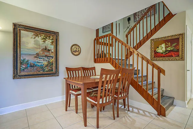 a view of staircase with furniture and a window