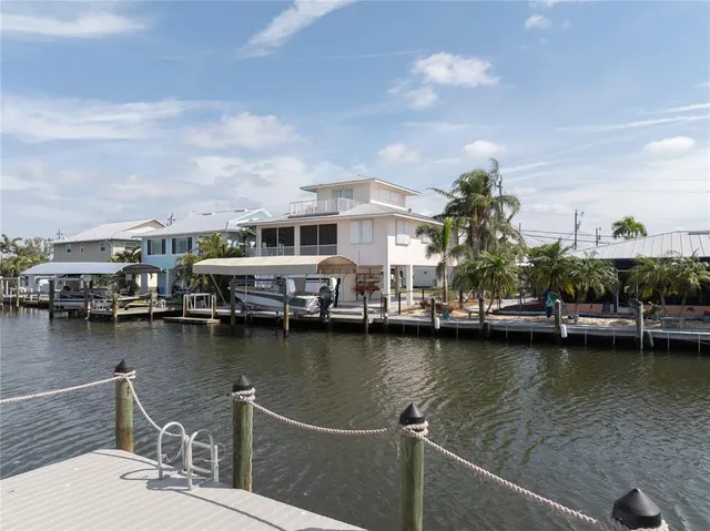 an aerial view of a house with a lake view