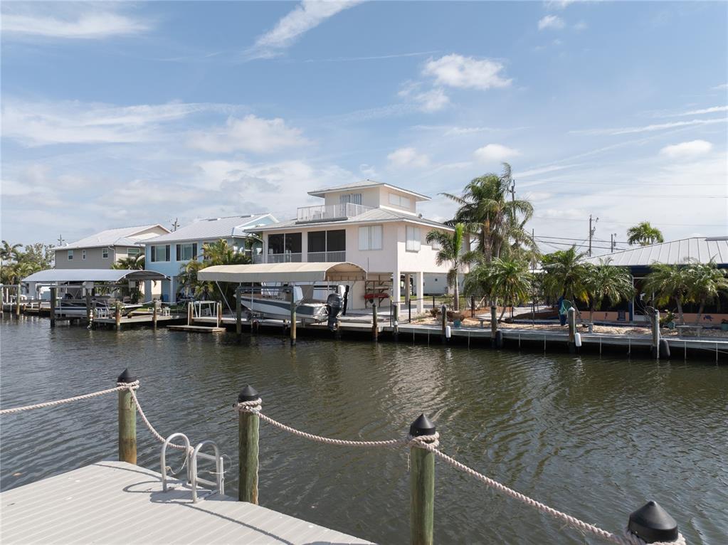 11476 May Street Matlacha, FL 33993 - Photo 11 of 43 a view of a lake with boats and trees