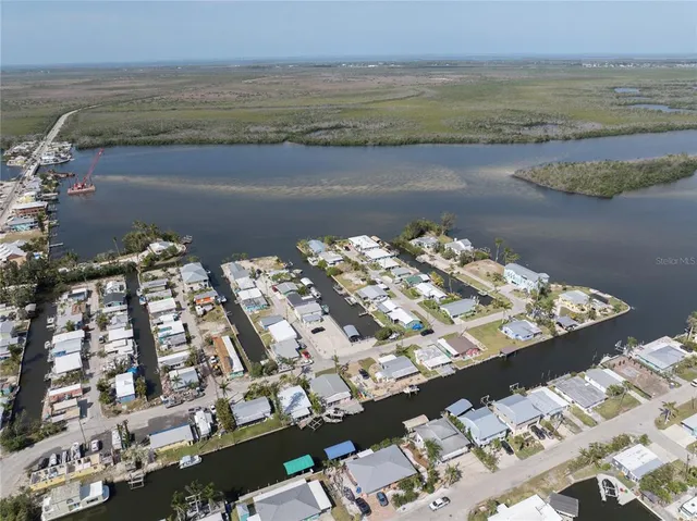 an aerial view of a city with lawn chairs