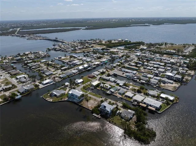a view of a lake with lots of boats and trees