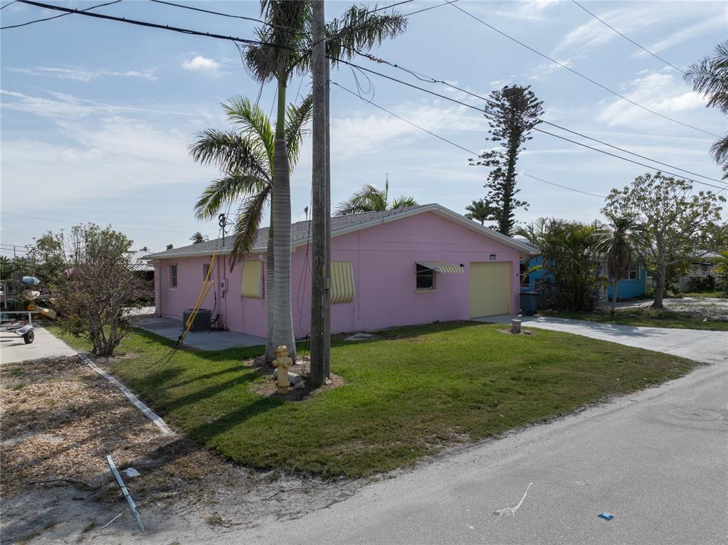 11476 May Street Matlacha, FL 33993 - Photo 2 of 43 a house view with a garden space
