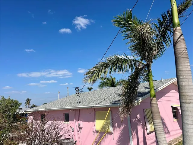 a porch with table and chairs