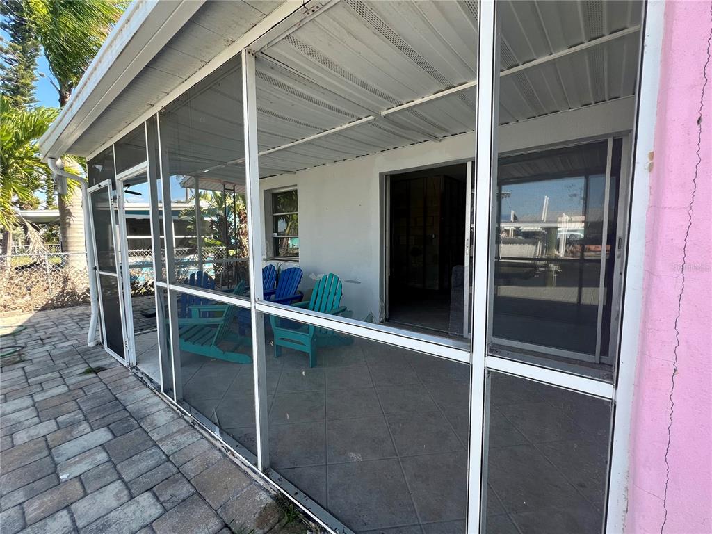 11476 May Street Matlacha, FL 33993 - Photo 28 of 43 a porch with table and chairs