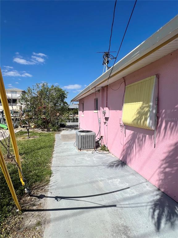 11476 May Street Matlacha, FL 33993 - Photo 30 of 43 a view of a house with a yard