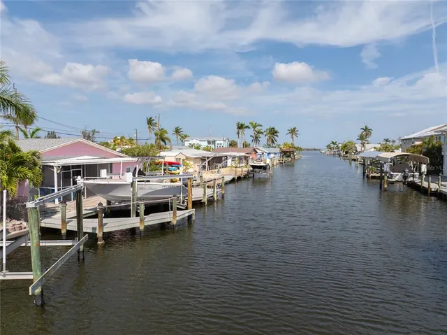 an aerial view of a house with a lake view