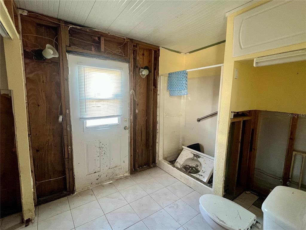 11476 May Street Matlacha, FL 33993 - Photo 40 of 43 a bathroom with a toilet and a shower