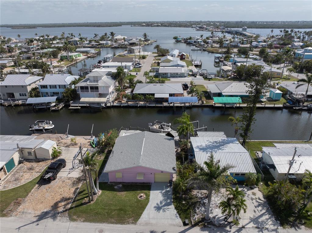 11476 May Street Matlacha, FL 33993 - Photo 4 of 43 an aerial view of a house with a lake view