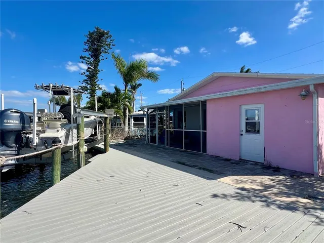 an aerial view of a house with a lake view