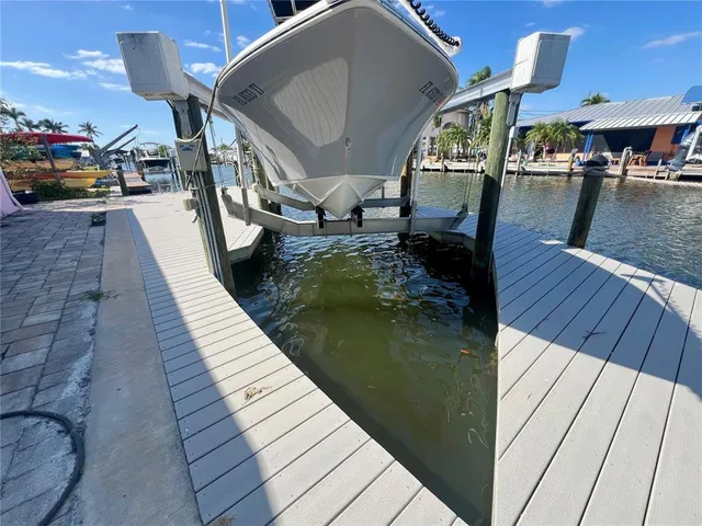 a view of a lake with boats and trees