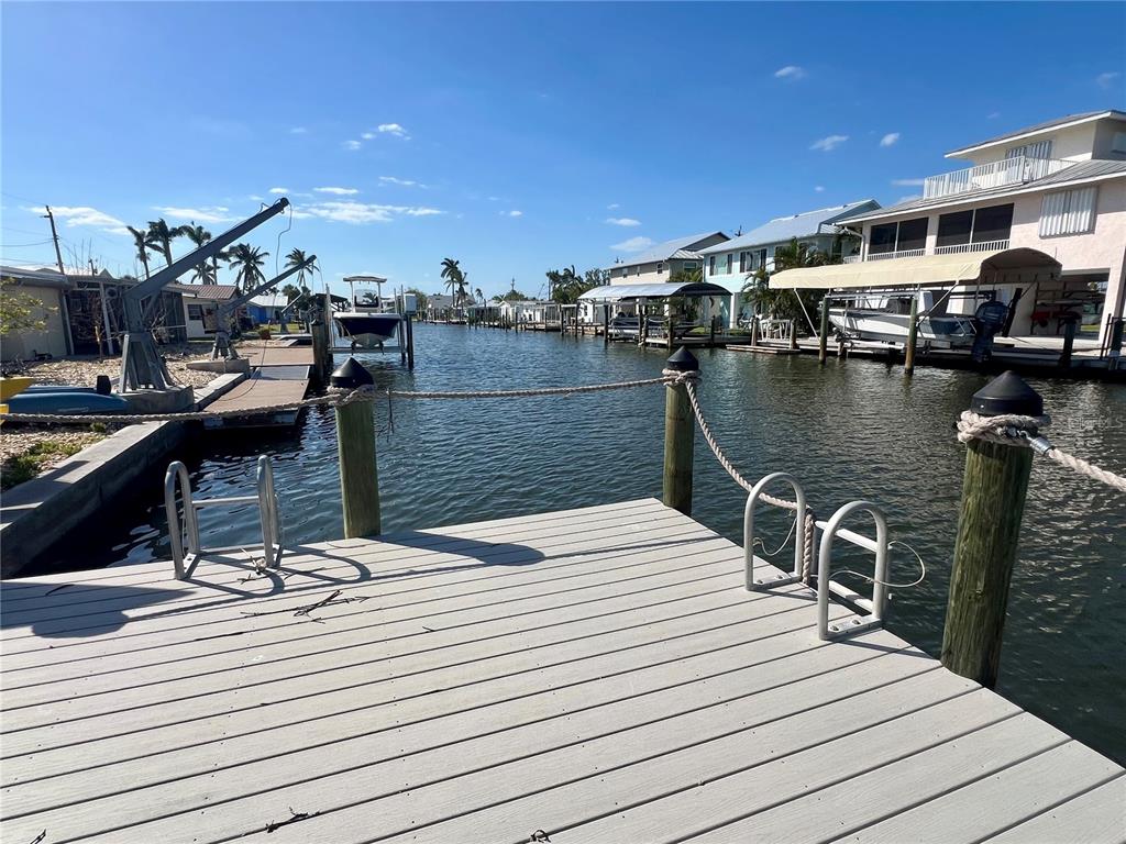 11476 May Street Matlacha, FL 33993 - Photo 9 of 43 a view of a terrace with wooden floor