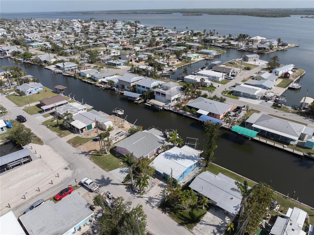 11476 May Street Matlacha, FL 33993 - Photo 10 of 43 an aerial view of a house with a lake view