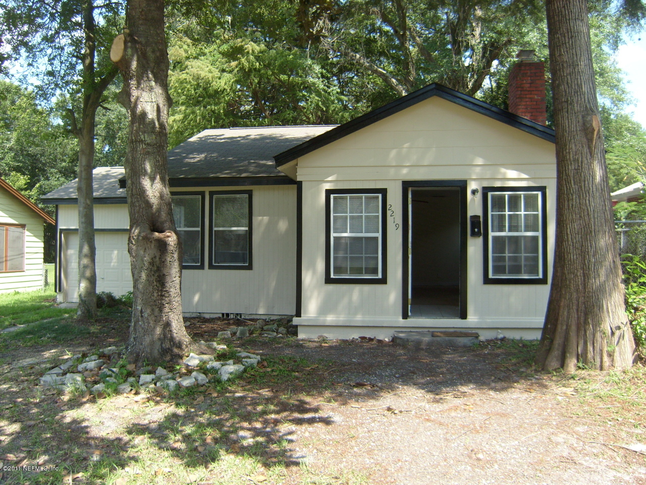 2219 Bayview Road Jacksonville, FL 32210 - Photo 1 of 11 a front view of a house with garden