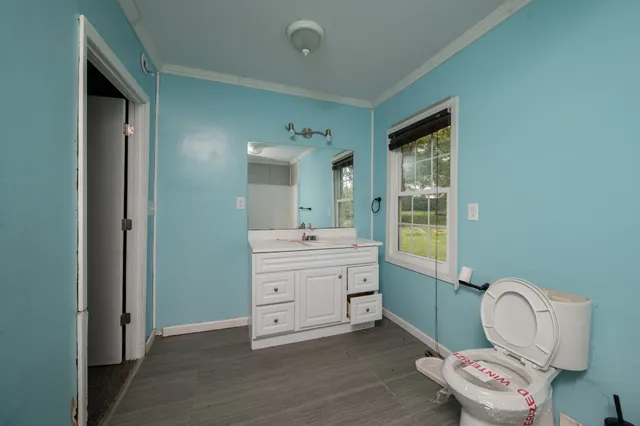 a room with a chair and a mirror