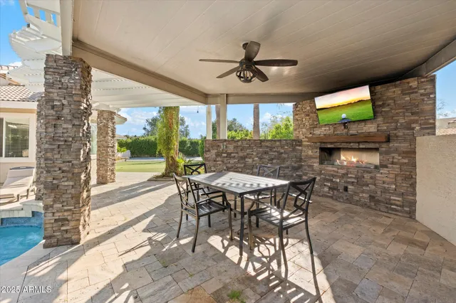 a view of an outdoor dining space with a table and chairs