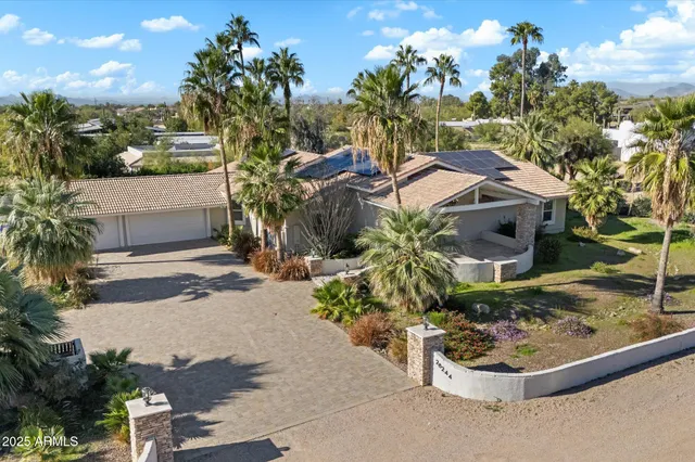a view of a garden with a house