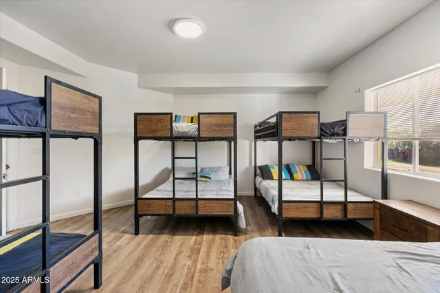 a bedroom with furniture and a window