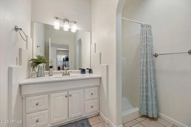 a bathroom with a double vanity sink and mirror