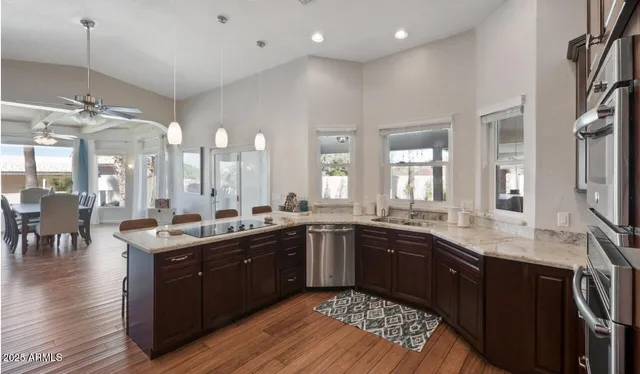 a large kitchen with lots of counter space and a sink