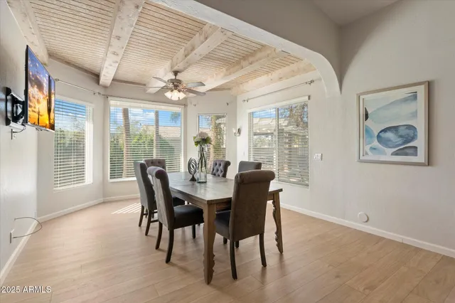 a view of a dining room with furniture window and wooden floor