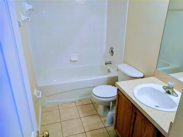 a bathroom with a sink a toilet and bathtub
