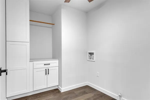 a view of cabinets with wooden floor