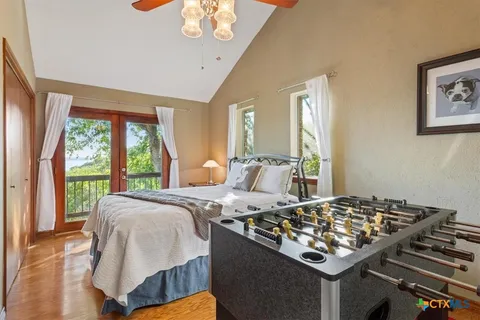 a living room with a bed and a table