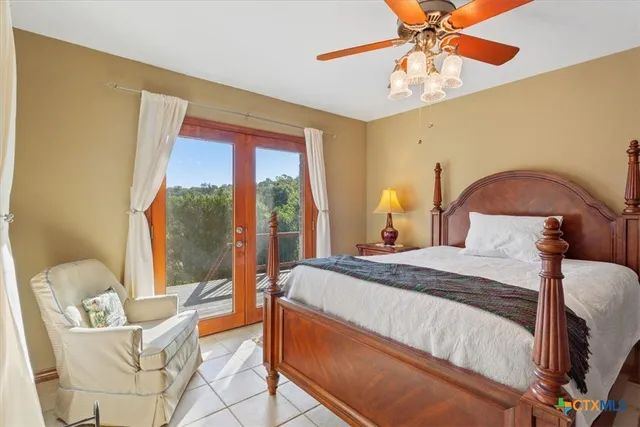 a bed room with a bed and a chandelier