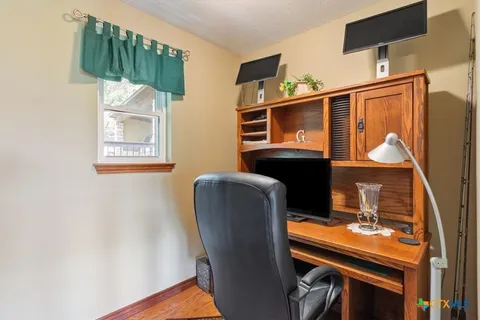 a dining room with furniture and window
