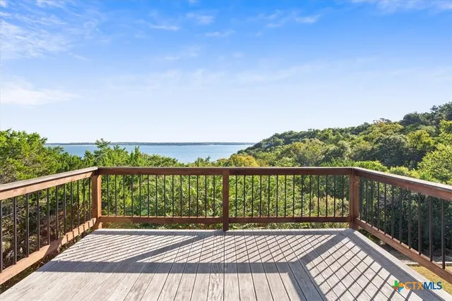 a view of balcony with wooden floor