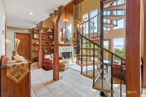 a view of living room kitchen and entryway