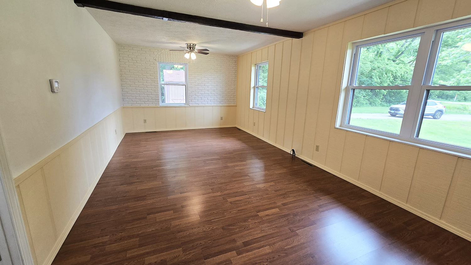 787 Walnut Hill Road Centralia, IL 62801 - Photo 18 of 42 an empty room with wooden floor and windows