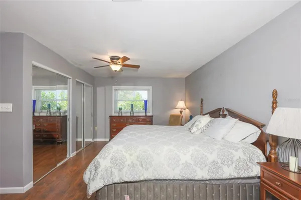 a bedroom with a large bed and a window