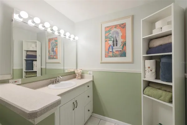 a bathroom with a double vanity sink and a mirror