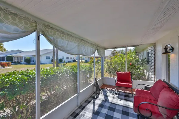 a balcony with chairs
