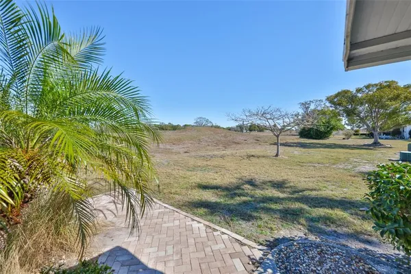 a view of a lake with a yard