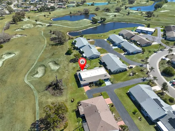 an aerial view of a house with outdoor space