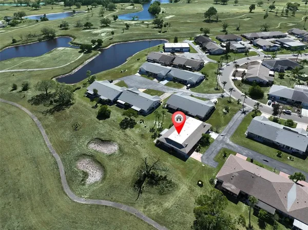 an aerial view of a houses with outdoor space