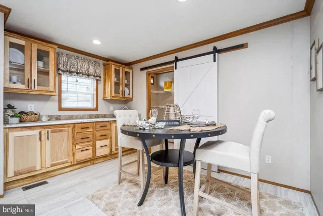 a kitchen with a table and chairs in it