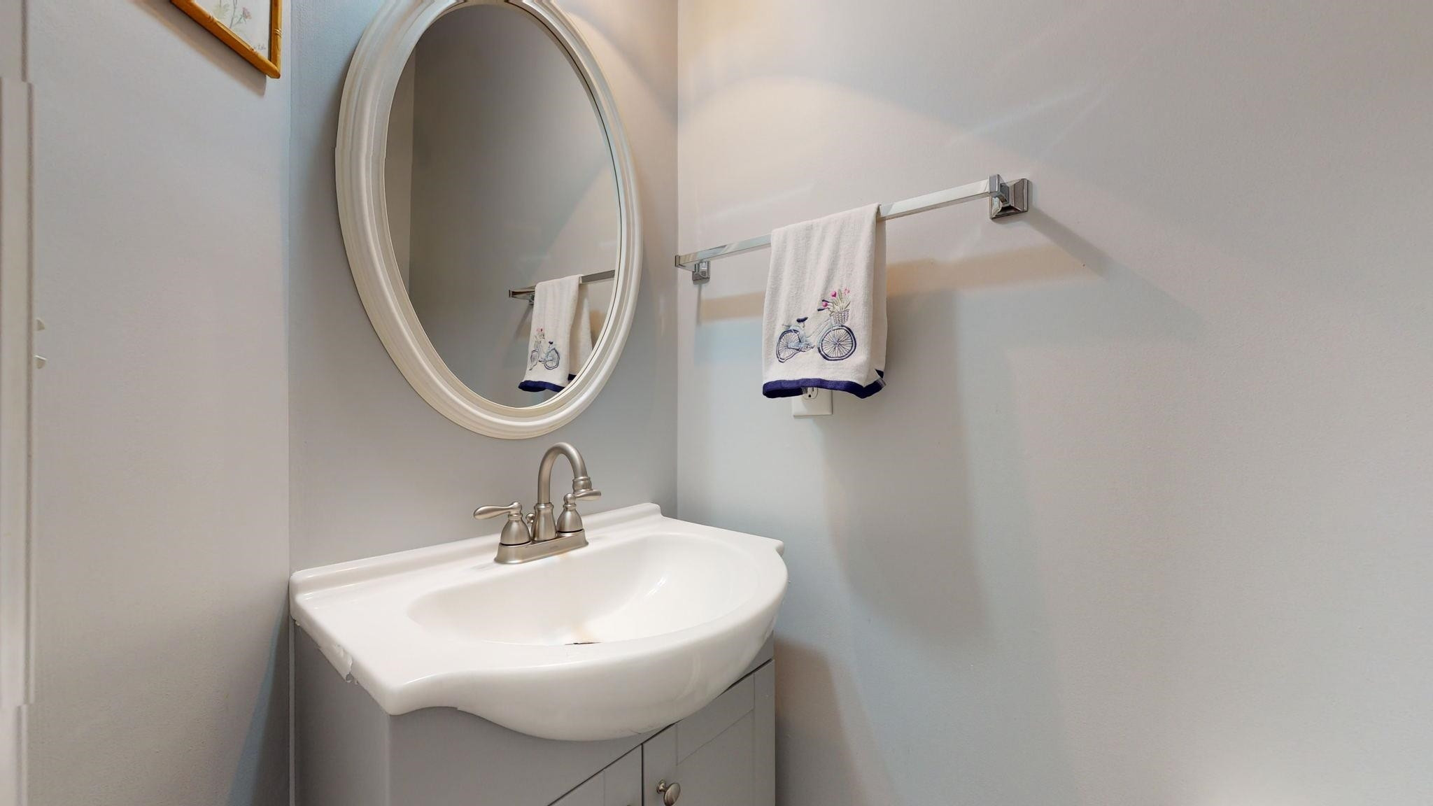 8405 Stoneyard Place Raleigh, NC 27613 - Photo 13 of 24 Half bath on main level has new toilet, vanity and sink! half bath
